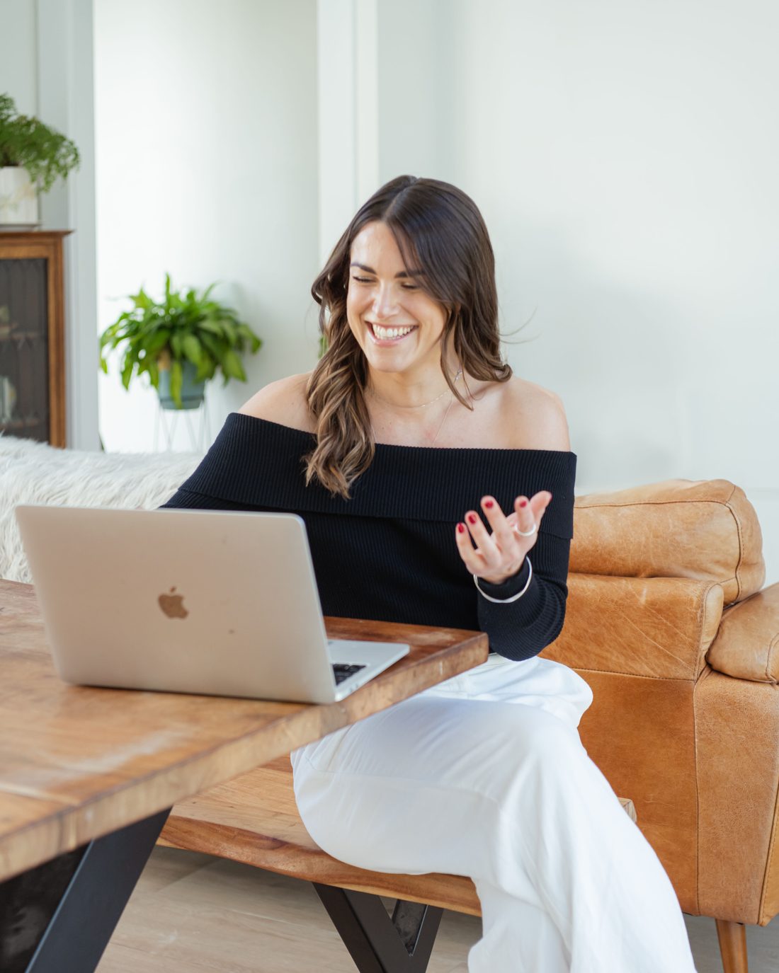Jess Drayton working at a laptop at home, relaxed
