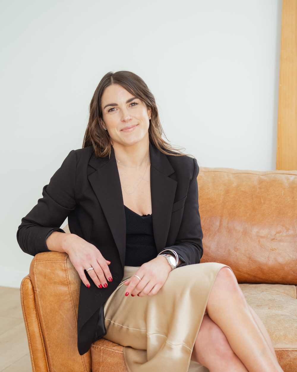 Jess Drayton, founder of The Zest Life, seated and looking to camera